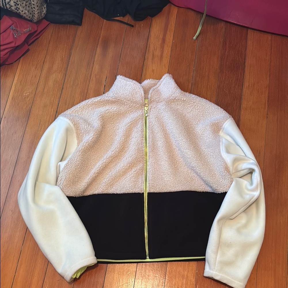 SoulCycle Cream and Black Jacket
